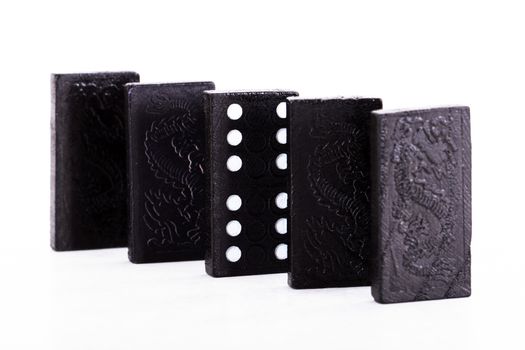 Row of dominoes, isolated on white background.