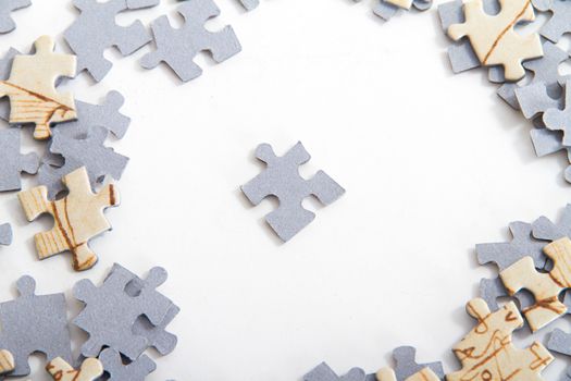 Leadership concept. Little puzzle piece among others on white.