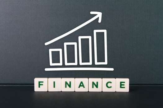 Finance word in letters and growth chart.