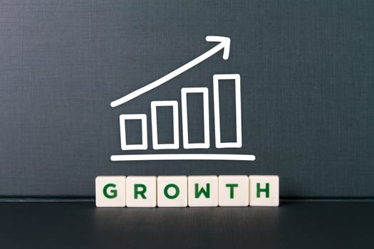 Growth word in letters with bar chart.