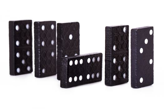Row of dominoes, isolated on white background.