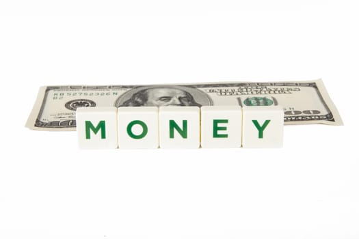 Money word in letters and one hundred dollar bill, isolated on white background.