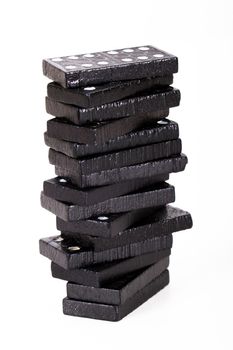 Stack of dominoes, isolated on white background.