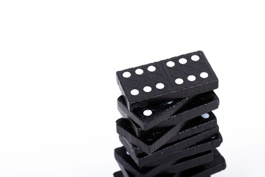 Stack of dominoes, isolated on white background.
