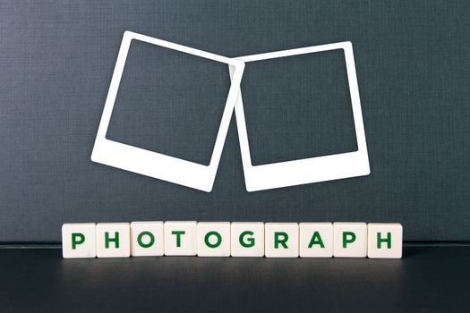 Photography word in letters and white photo frames.
