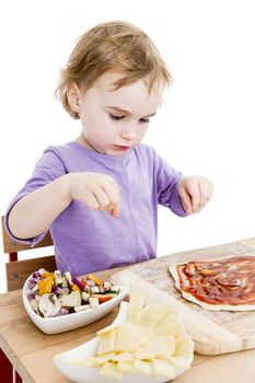 girl making fresh pizza in white background. studio shot