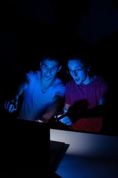 Two guys in front of a computer screen