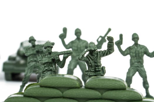 Miniature toy soldiers, isolated on white background.
