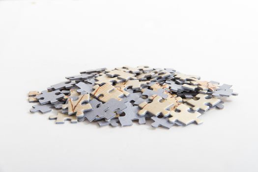 Complex little puzzle pieces, isolated on white background.