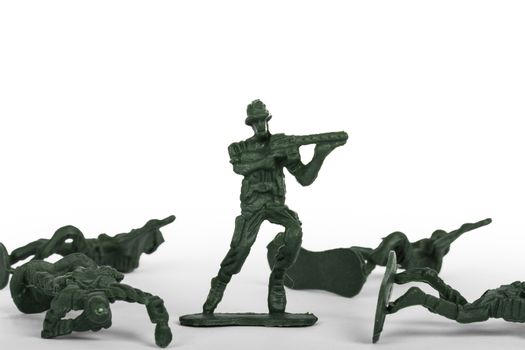 Miniature toy soldiers, isolated on white background.