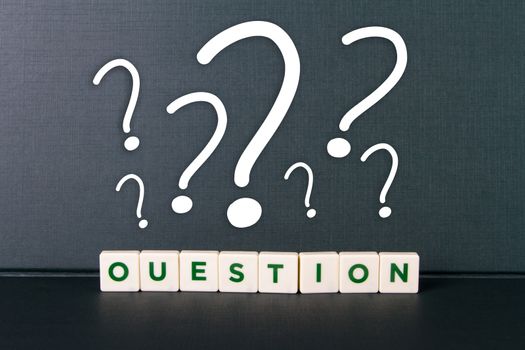Question word in letters and question mark icons.