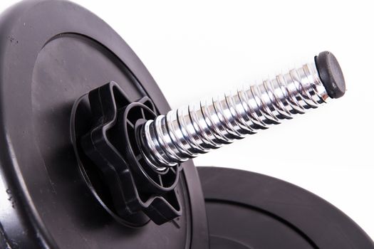 Black gym barbell, dumbbell with disks, isolated on white background.
