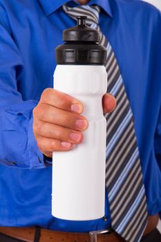 Businessman showing sport water bottle.