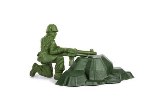 Miniature toy soldier, isolated on white background.