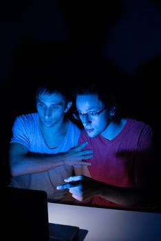 Two guys in front of a computer screen