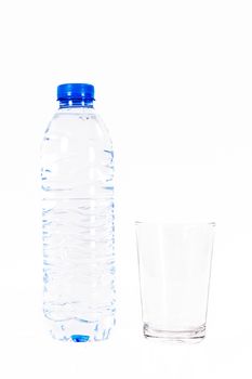 Plastic water bottle and glass, isolated on white background.