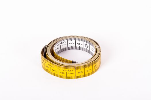 Yellow measure tape, isolated on white background.