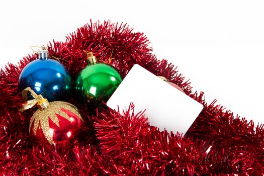 Christmas ornaments and blank greeting card for your message, isolated on white background.