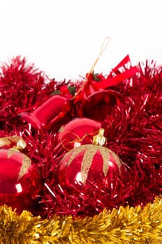 Red and yellow christmas ornaments, balls, bells with space, isolated on white background.