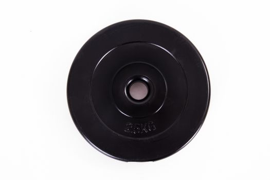 Black barbell disk, isolated on white background.