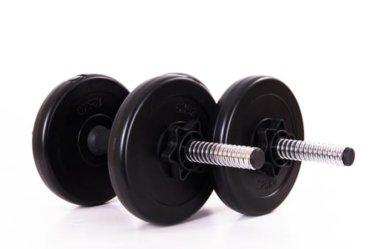 Black gym barbells, dumbbells, isolated on white background.