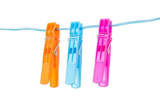 Colorful clothespins on blue nylon rope, isolated on white background.