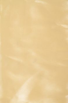 Abstract yellow background fabric,cloth, silk texture satin or velvet material.
