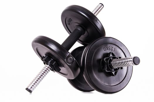 Black gym barbell, dumbbell with disks, isolated on white background.