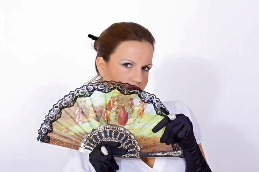 portrait of young woman with colorful fan