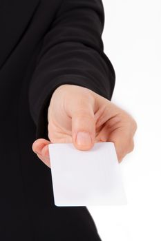 Business woman in dark suit shows white blank business card with space.
