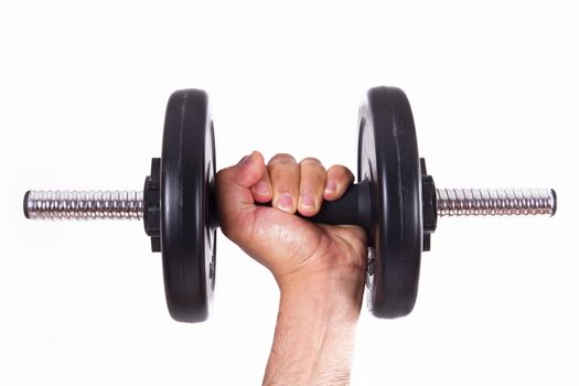 Hand holding black gym barbell, dumbbell with disks, isolated on white background.