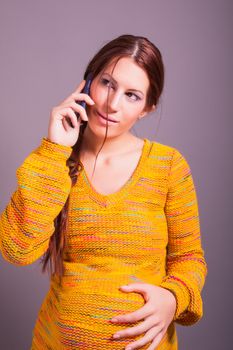 portrait of pregnant woman talking on cell phone