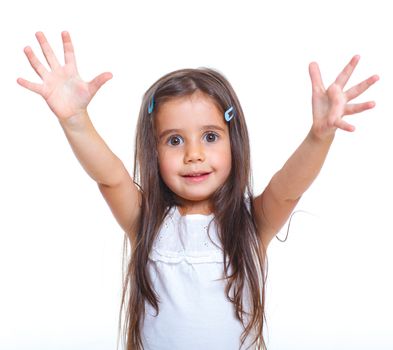 Beautiful little girl with hands up happy smiling in studio. Isolated white background