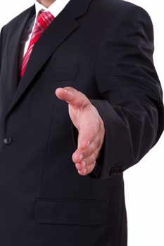 Businessman extends hand to shake or helping, isolated on white.