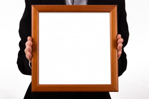Business woman hand holding and showing white, empty, wooden bordered frame for your message or photo, isolated on white background.
