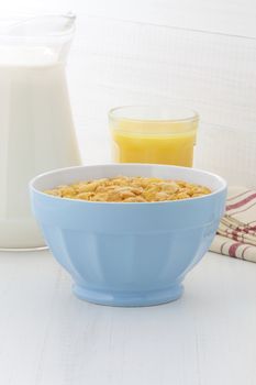 delicious and healthy corn flakes, with fresh milk and orange juice