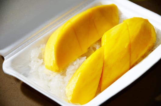 Native Thai style of dessert, Mango with sticky rick in foam package