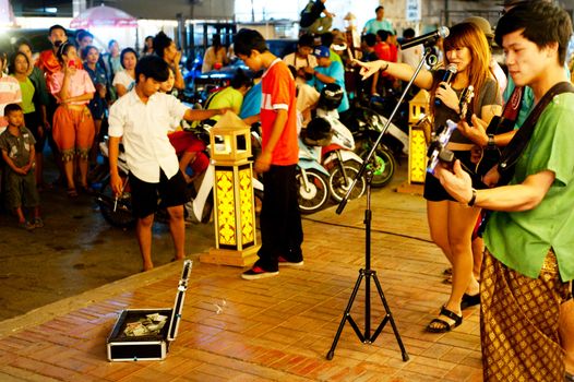 Lopburi, Thailand - Feb 23, 2013: Unidentified street musicians performing during the land of King Narai festival in Lopburi, Thailand