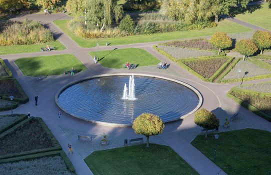 big garden with water pond and fountain