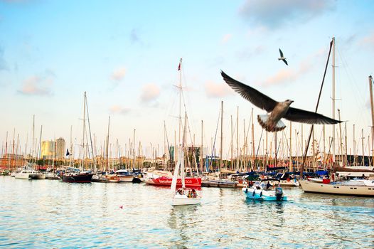 Barcelona, Spain -  September 25, 2013: People on a yachts in Port Vell in Barcelona, Spain. Port Vell is the oldest and largest port in the city