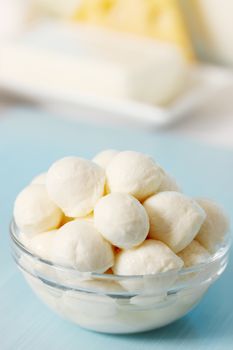 Small balls of mozzarella in a transparent bowl