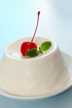 dessert of ricotta cheese with cocktail cherry