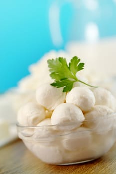 Small balls of mozzarella in a transparent bowl