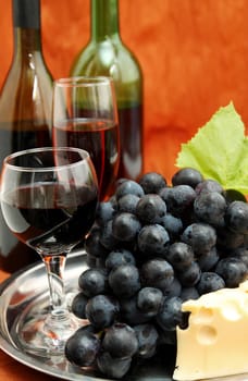 still life with wine bottle, wine glass and grapes