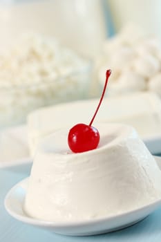 dessert of ricotta cheese with cocktail cherry