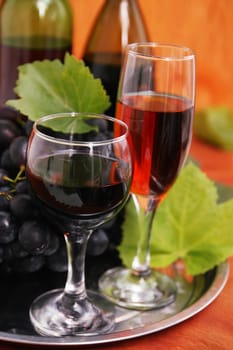 still life with wine bottle, wine glass and grapes