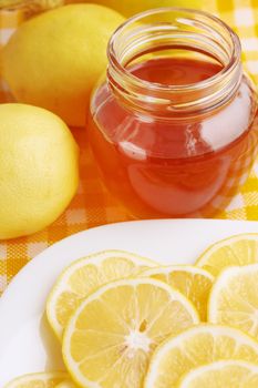 Flavored honey and lemon on a plate