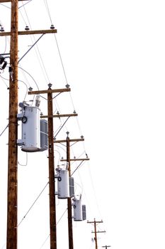 Row utility poles hung with electricity power cables and transformers for residential electric power supply isolated on white background