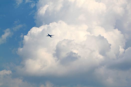 Aircraft flying in the sky against the background of clouds