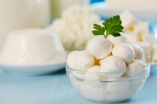 Small balls of mozzarella in a transparent bowl